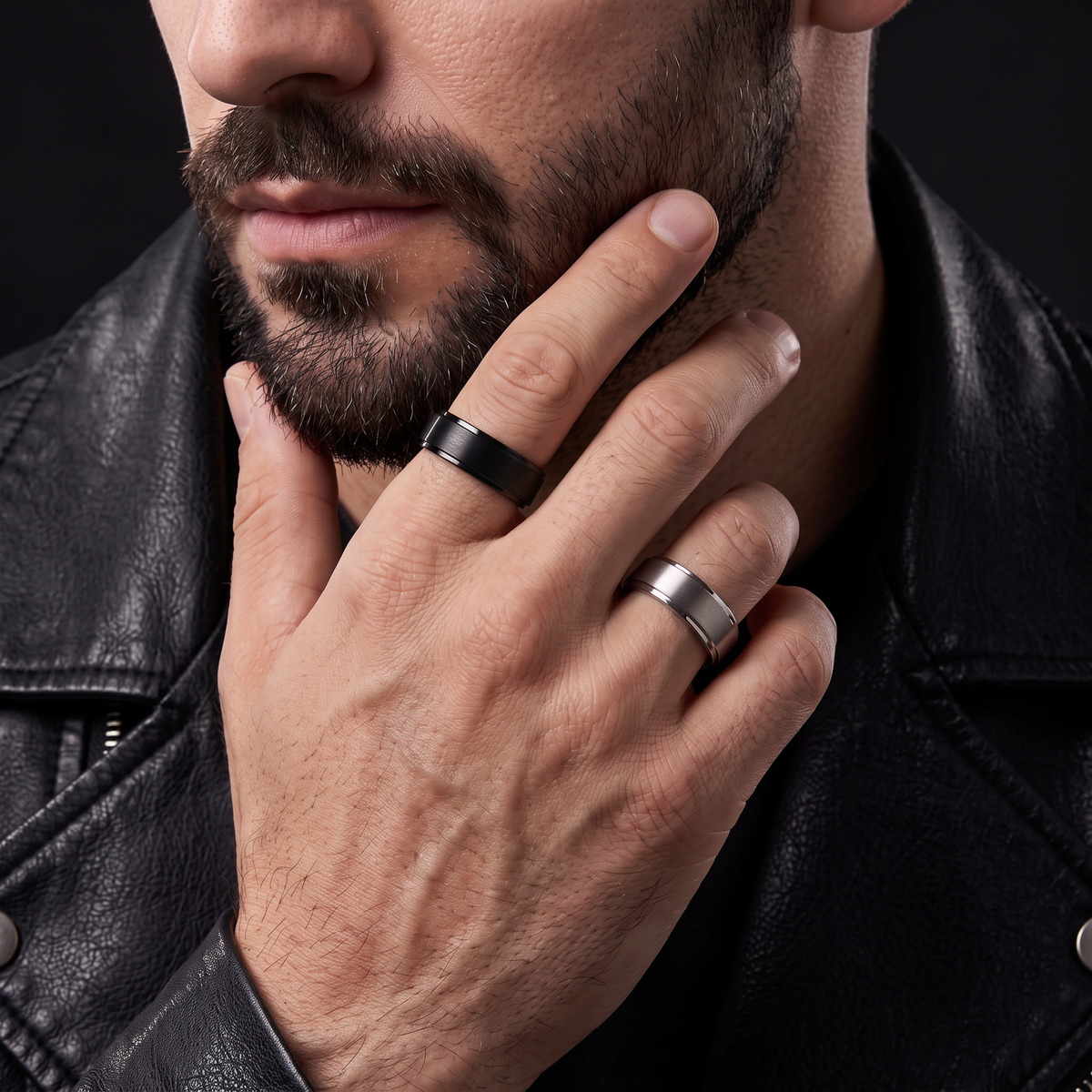 VLKRY - Pure Titanium Jewelry Statement Ring in matte black titanium with polished edges worn on a man's hand